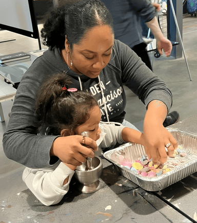 Child doing crafts at American Mural Project