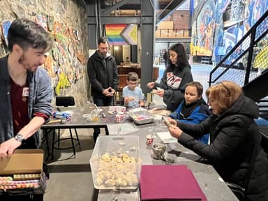 Families crafting at American Mural Project