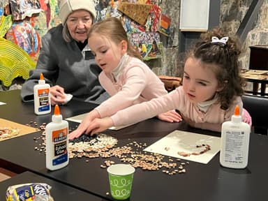 Children doing bean art at American Mural Project