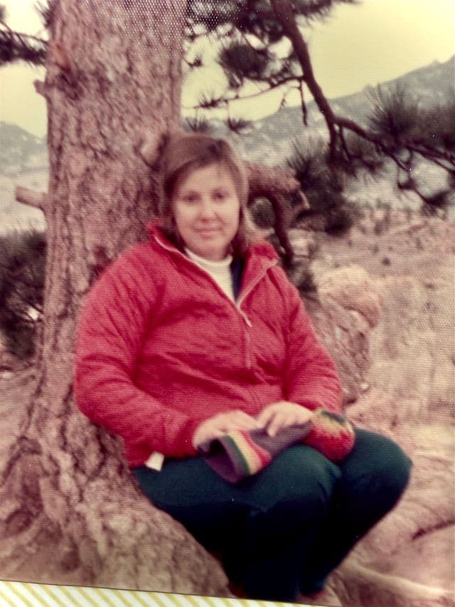 Hazel sitting by a tree in the mountains, Boulder CO, 1975