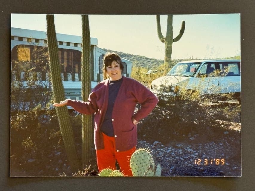 Hazel standing with cacti in Tucson, Arizona